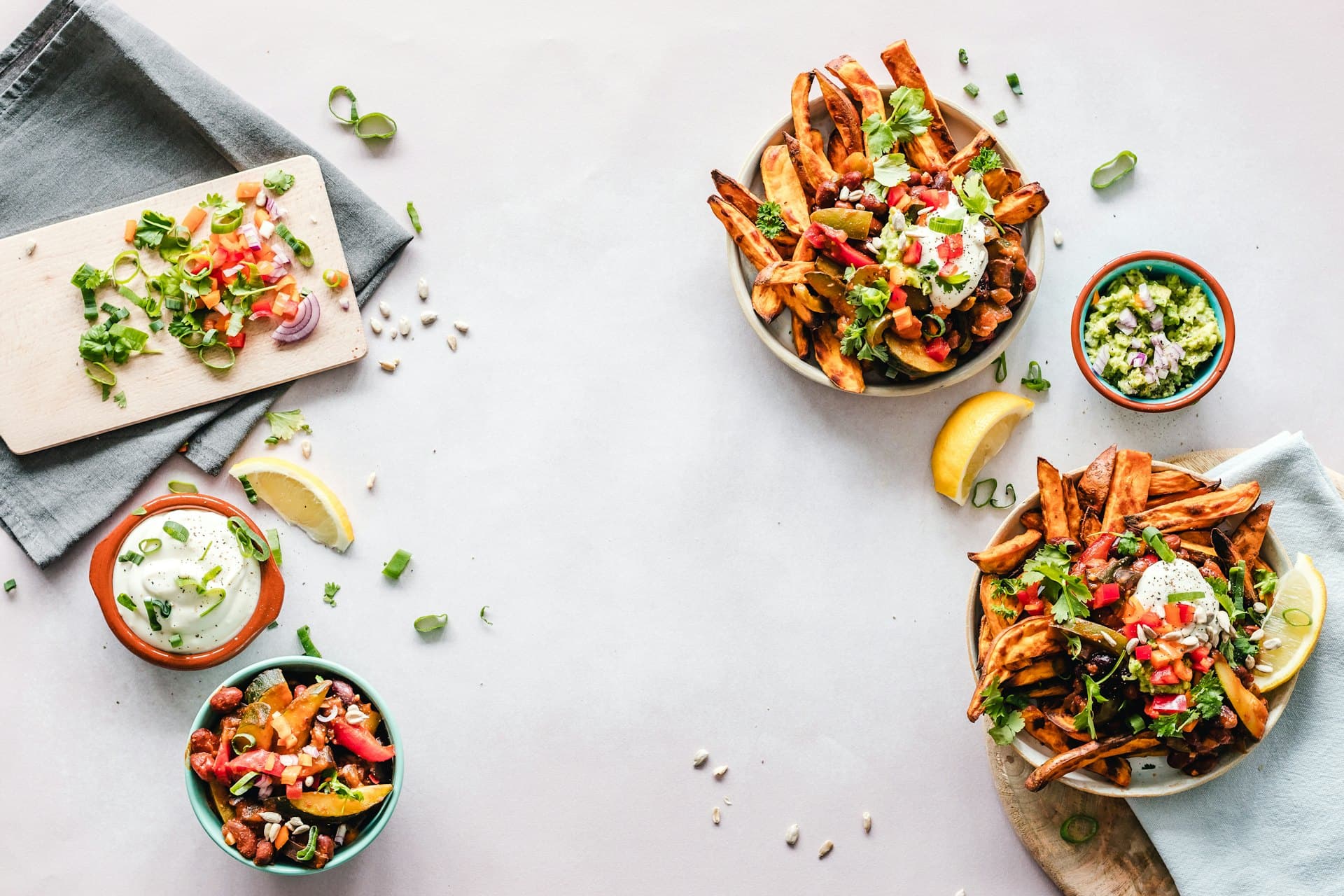Meal prep containers and cooked dishes on a kitchen counter